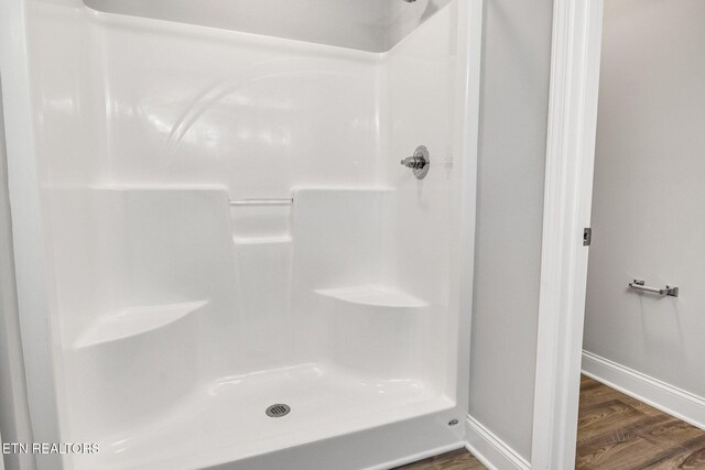205 Harper Village Way, Lenoir City, TN 37771 - full bathroom featuring wood finished floors and a shower