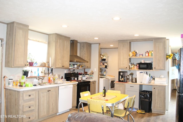 831 Fritzsche, Jamestown, TN 38556 - kitchen featuring wall chimney exhaust hood, dishwasher, washer and clothes dryer, black microwave, and electric stove