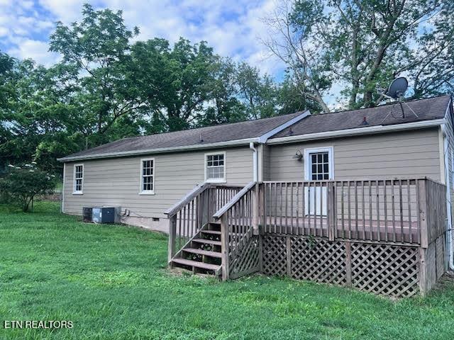 7832 Brickyard Rd, Powell, TN 37849 - back of property featuring a wooden deck, crawl space, a lawn, and central AC unit