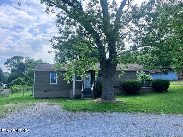 7832 Brickyard Rd, Powell, TN 37849 - obstructed view of property with crawl space and a front lawn