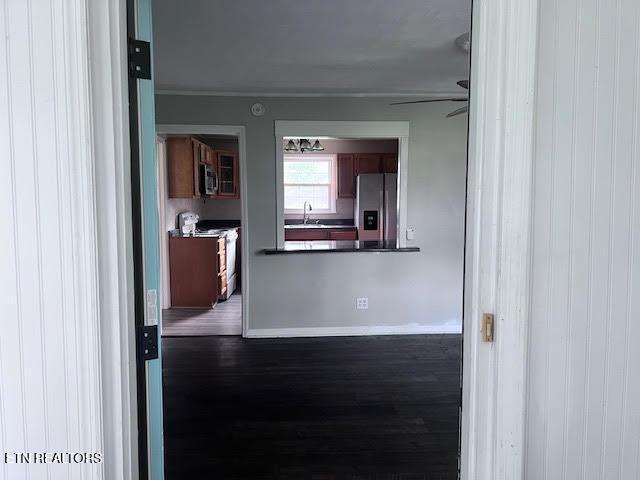 7832 Brickyard Rd, Powell, TN 37849 - corridor featuring wood finished floors, a sink, and baseboards