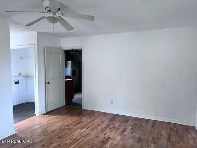 7832 Brickyard Rd, Powell, TN 37849 - spare room with a ceiling fan, wood finished floors, and baseboards