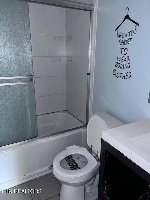 7832 Brickyard Rd, Powell, TN 37849 - full bathroom featuring toilet, vanity, and shower / bath combination with glass door
