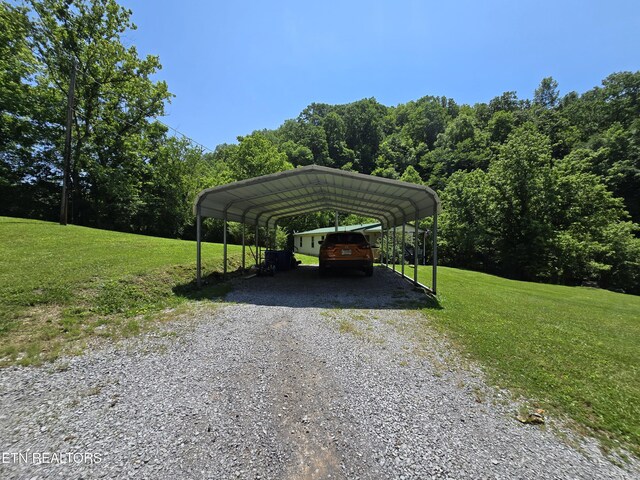 417 Ely Town Rd, Dryden, VA 24243 - view of vehicle parking featuring gravel driveway and a carport