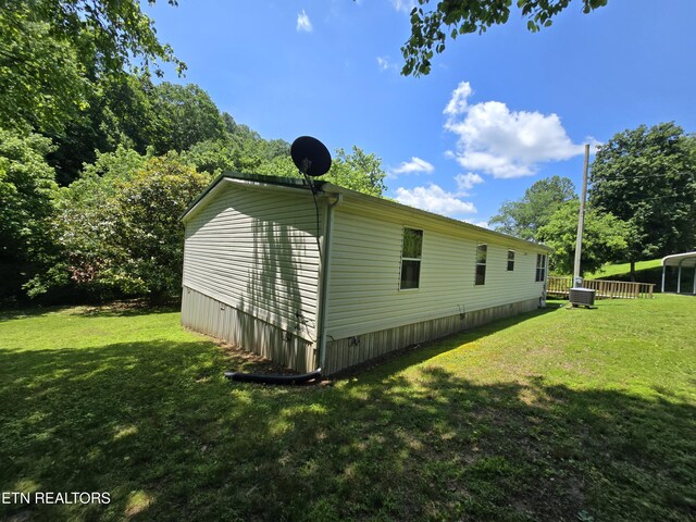 417 Ely Town Rd, Dryden, VA 24243 - view of home's exterior featuring a lawn and central air condition unit