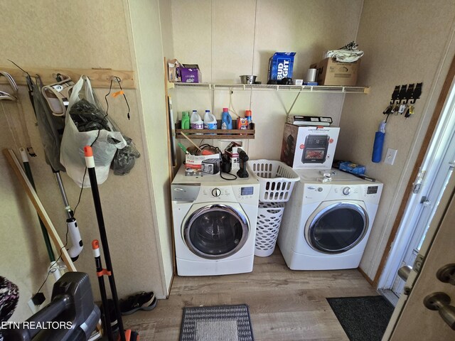 417 Ely Town Rd, Dryden, VA 24243 - laundry area with washer and dryer and wood finished floors
