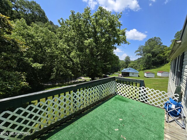 417 Ely Town Rd, Dryden, VA 24243 - wooden deck featuring a yard and an outbuilding