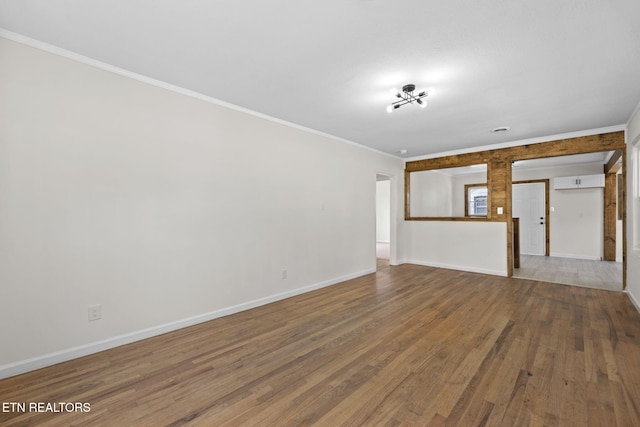 2504 Larkwood Ln, Knoxville, TN 37921 - unfurnished living room with ornamental molding, wood finished floors, and an AC wall unit