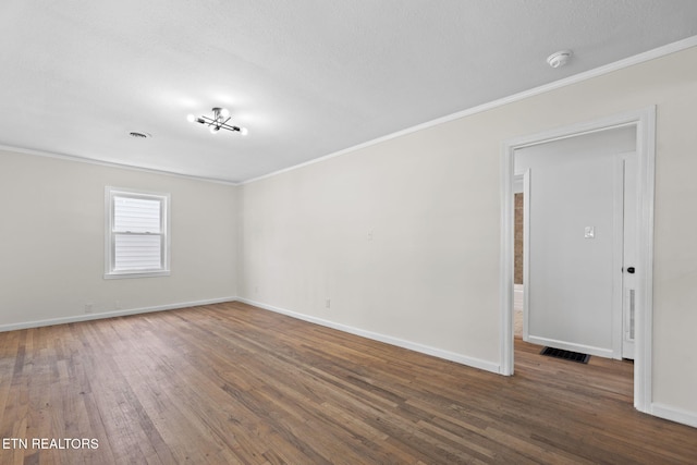 2504 Larkwood Ln, Knoxville, TN 37921 - spare room with ornamental molding, wood finished floors, a smoke detector, and a textured ceiling