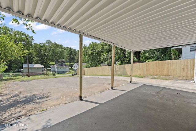 2504 Larkwood Ln, Knoxville, TN 37921 - view of patio featuring view of wooded area and a carport