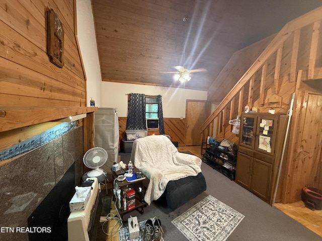227 Bart Woolum, Lancing, TN 37770 - living area with wooden walls, carpet, vaulted ceiling, wainscoting, and ceiling fan