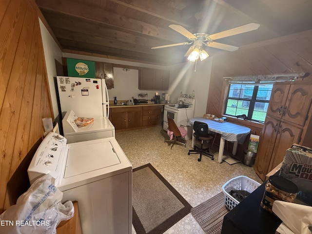 227 Bart Woolum, Lancing, TN 37770 - laundry room featuring separate washer and dryer, ceiling fan, and wood walls