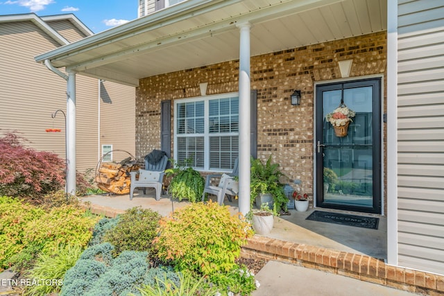8431 Vessel Ln, Powell, TN 37849 - entrance to property with a porch and brick siding
