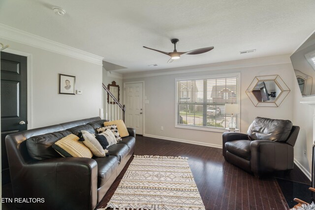 8431 Vessel Ln, Powell, TN 37849 - living area featuring stairway, dark wood-style floors, ceiling fan, and ornamental molding