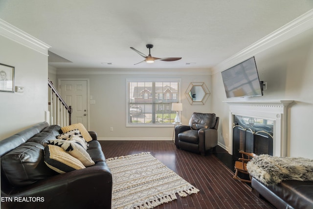 8431 Vessel Ln, Powell, TN 37849 - living room with stairway, a fireplace, a ceiling fan, dark wood-style floors, and crown molding