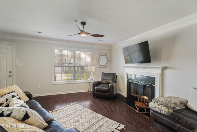 8431 Vessel Ln, Powell, TN 37849 - living room featuring a ceiling fan, ornamental molding, a fireplace with raised hearth, and hardwood / wood-style floors