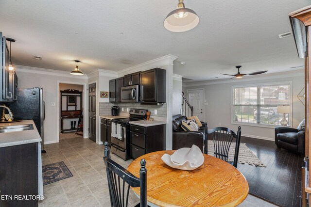 8431 Vessel Ln, Powell, TN 37849 - dining room with a ceiling fan and crown molding