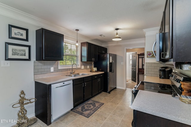 8431 Vessel Ln, Powell, TN 37849 - kitchen with stainless steel appliances, decorative backsplash, ornamental molding, light countertops, and hanging light fixtures