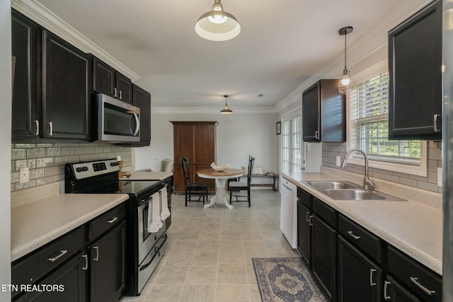 8431 Vessel Ln, Powell, TN 37849 - kitchen featuring stainless steel appliances, backsplash, light countertops, and crown molding
