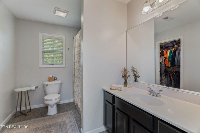 8431 Vessel Ln, Powell, TN 37849 - bathroom with vanity, tile patterned flooring, and a walk in closet