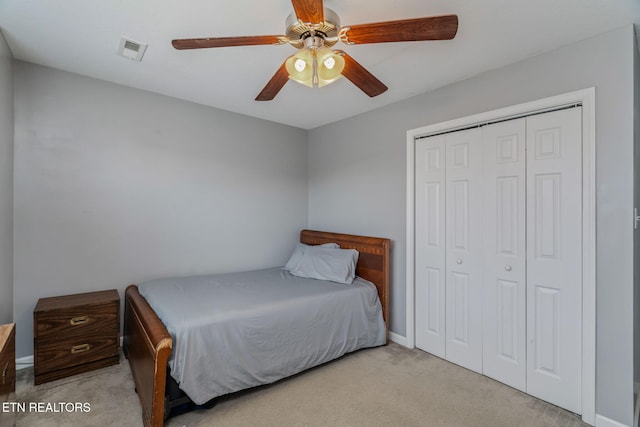 8431 Vessel Ln, Powell, TN 37849 - bedroom with light carpet, a closet, and a ceiling fan
