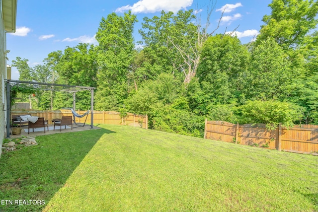 8431 Vessel Ln, Powell, TN 37849 - fenced backyard with a patio, a pergola, and an outdoor living space