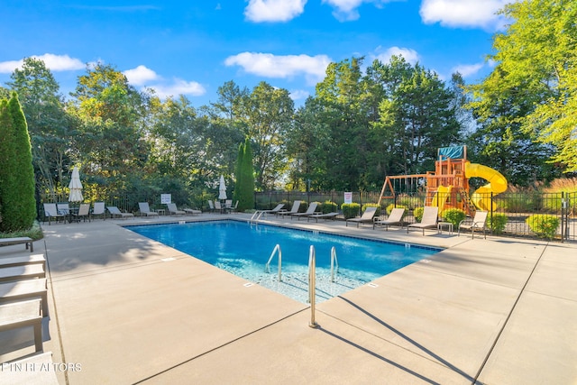8431 Vessel Ln, Powell, TN 37849 - community pool with a patio area and view of wooded area
