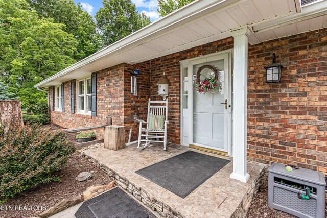 314 Longview Dr, Wartburg, TN 37887 - doorway to property with brick siding and covered porch