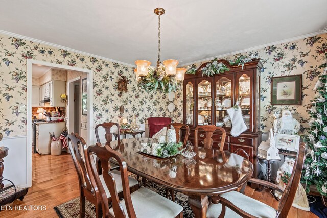 314 Longview Dr, Wartburg, TN 37887 - dining area featuring wallpapered walls, a chandelier, light wood-style floors, and ornamental molding