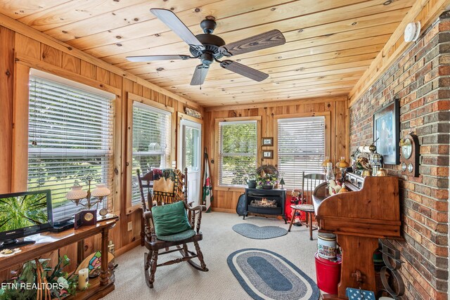 314 Longview Dr, Wartburg, TN 37887 - sitting room with wood walls, plenty of natural light, carpet floors, brick wall, and wooden ceiling