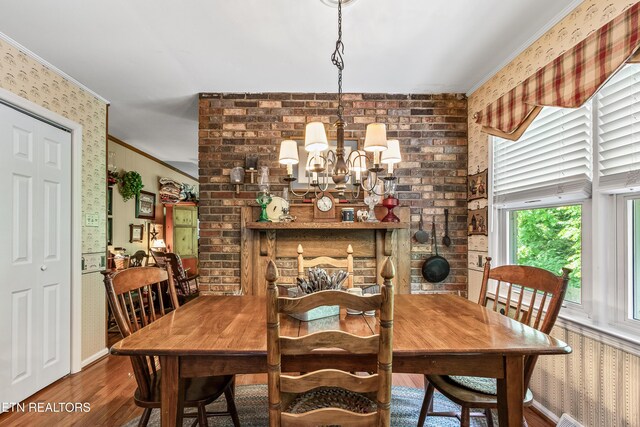 314 Longview Dr, Wartburg, TN 37887 - dining area featuring wallpapered walls, crown molding, a chandelier, and wood finished floors