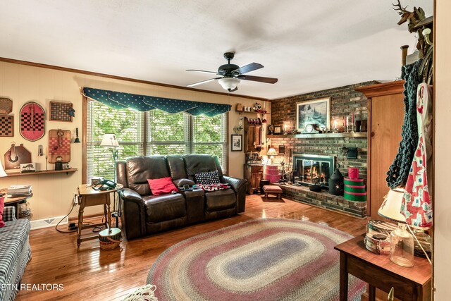 314 Longview Dr, Wartburg, TN 37887 - living room featuring ceiling fan, wood finished floors, a fireplace, and crown molding
