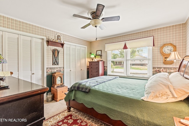 314 Longview Dr, Wartburg, TN 37887 - bedroom with wallpapered walls, multiple closets, ceiling fan, and carpet floors