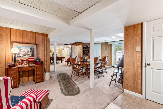 314 Longview Dr, Wartburg, TN 37887 - dining room featuring wooden walls, light tile patterned floors, and light colored carpet
