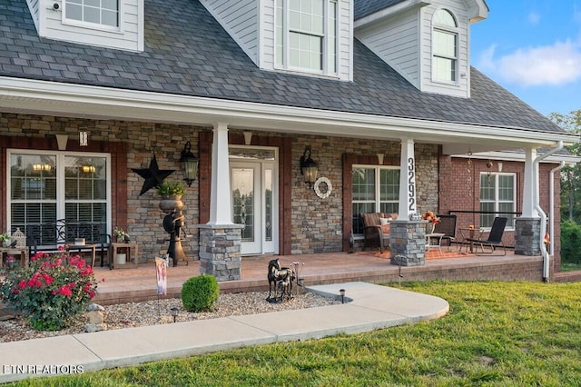 3292 Moss Arcott Rd, Celina, TN 38551 - view of exterior entry featuring a porch and stone siding