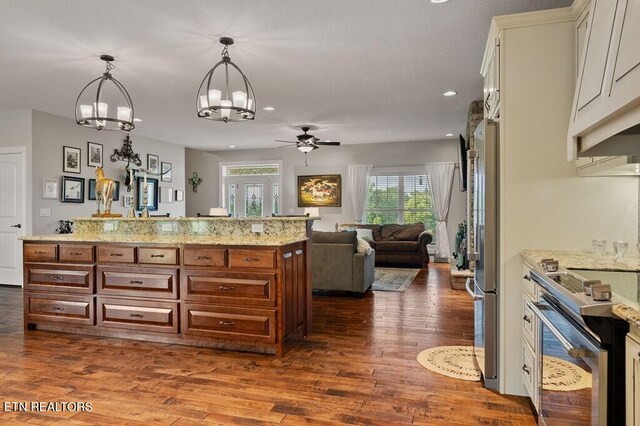 3292 Moss Arcott Rd, Celina, TN 38551 - kitchen with stainless steel appliances, ceiling fan, a chandelier, recessed lighting, and dark wood-style flooring
