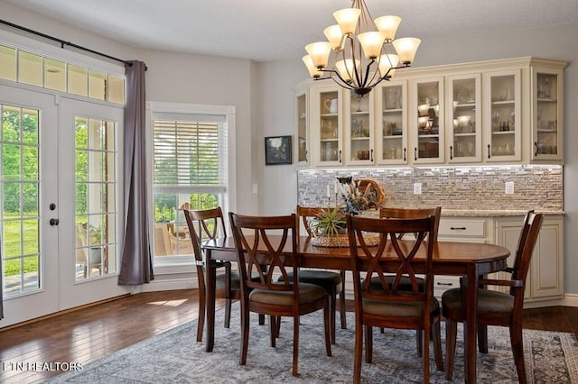 3292 Moss Arcott Rd, Celina, TN 38551 - dining room with dark wood-type flooring, a chandelier, and french doors