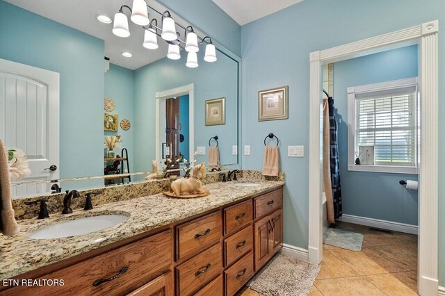 3292 Moss Arcott Rd, Celina, TN 38551 - full bath with double vanity, tile patterned floors, and baseboards