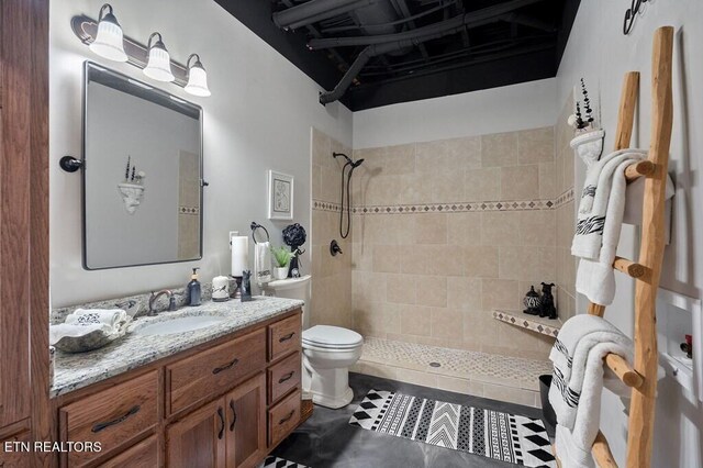 3292 Moss Arcott Rd, Celina, TN 38551 - full bath with toilet, tiled shower, vanity, and tile patterned floors