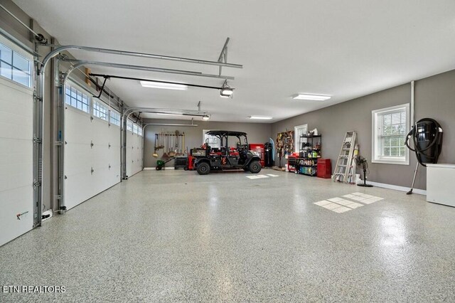 3292 Moss Arcott Rd, Celina, TN 38551 - garage featuring a garage door opener