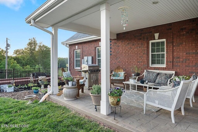 3292 Moss Arcott Rd, Celina, TN 38551 - view of patio with an outdoor living space and a grill