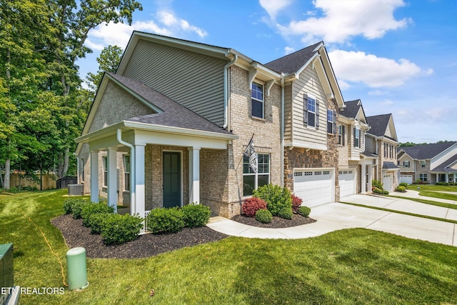 1007 Wigmore Way, Knoxville, TN 37932 - view of front of house featuring concrete driveway, a garage, a front yard, and a shingled roof