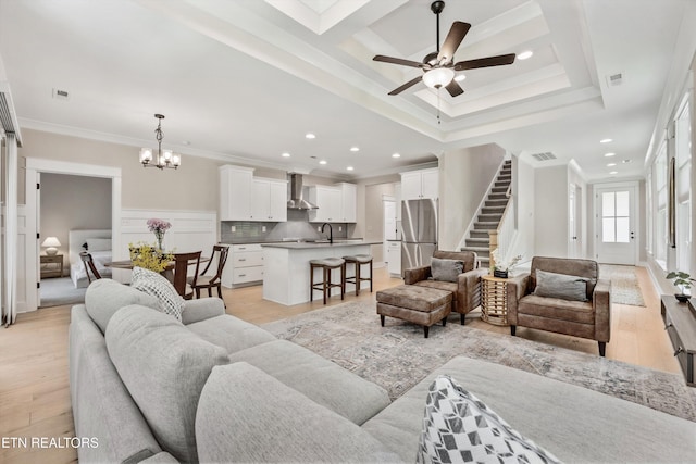 1007 Wigmore Way, Knoxville, TN 37932 - living room with crown molding, stairway, a chandelier, ceiling fan, and recessed lighting