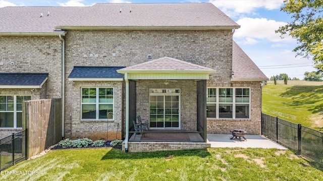 1007 Wigmore Way, Knoxville, TN 37932 - back of house with a patio, brick siding, and roof with shingles
