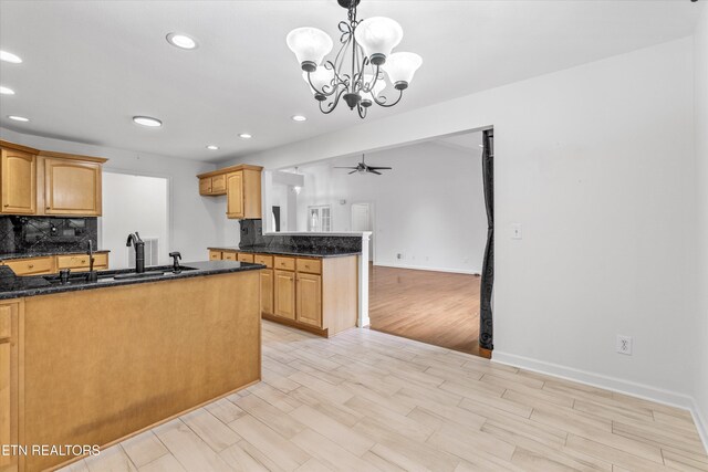 140 Chuniloti Way, Loudon, TN 37774 - kitchen with decorative backsplash, recessed lighting, a peninsula, ceiling fan, and dark stone counters