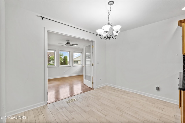 140 Chuniloti Way, Loudon, TN 37774 - unfurnished dining area with light wood finished floors, a chandelier, and a ceiling fan