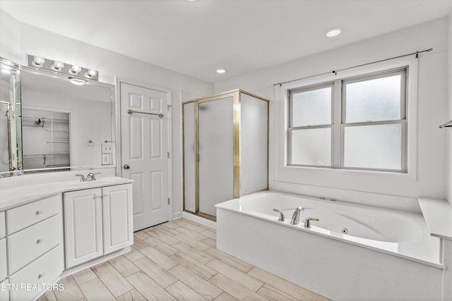 140 Chuniloti Way, Loudon, TN 37774 - bathroom featuring a shower stall, a tub with jets, vanity, and recessed lighting