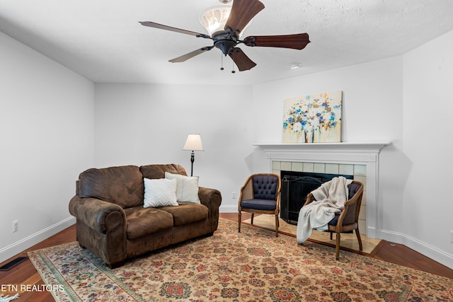 1312 Zachary Taylor Rd, Knoxville, TN 37922 - living room featuring a ceiling fan, wood finished floors, and a fireplace