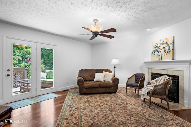 1312 Zachary Taylor Rd, Knoxville, TN 37922 - living area with a fireplace, ceiling fan, wood finished floors, and a textured ceiling