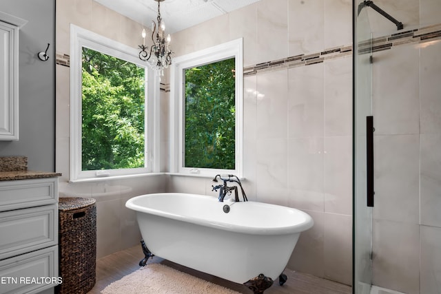 1312 Zachary Taylor Rd, Knoxville, TN 37922 - full bathroom featuring plenty of natural light, tile walls, a freestanding bath, and a shower stall
